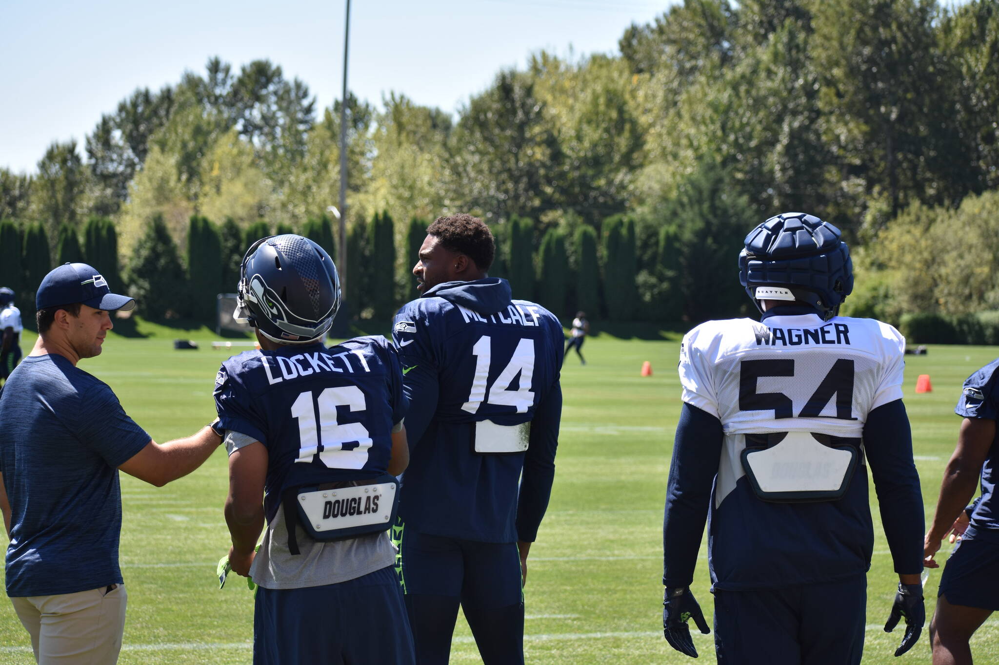 Seahawks fan favorites Tyler Lockett, DK Metcalf and Bobby Wagner talk before practice gets underway Aug. 1. (Photos by Ben Ray/Sound Publishing)