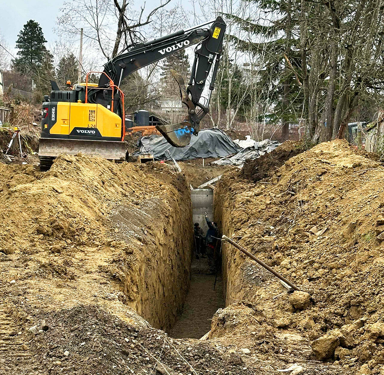 The state Department of Labor & Industries (L&I) cited a Kirkland company for having these workers in a trench at a Kent construction site without proper safety measures, including a trench box, according to L&I officials. COURTESY PHOTO, L&I