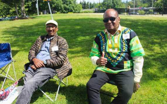 Volunteers enjoy the sunshine at Renton’s 2024 Juneteenth Celebration. The weather will be sunny this weekend as summer officially starts. Photo by Bailey Jo Josie/Sound Publishing