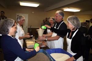 Rotary Club of Kirkland Downtown members measure lentils