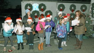 Local Kirkland Girl Scouts from troop 44035 sing at the Kirkland Kiwanis tree lot at Juanita Beach Park on Nov. 30.