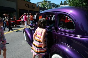 A girl looks inside of a classic car during the Kirkland Classic Car Show in years past. This year marks the car show's 10th anniversary.