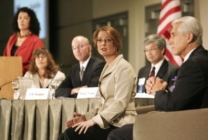 Darcy Burner answers a questioin as incumbent Rep. Dave Reichert (right) and other panelists look on during the U.S. House of Representatives 8th Congressional District Debate at Meydenbauer Center in Bellevue Oct. 8.