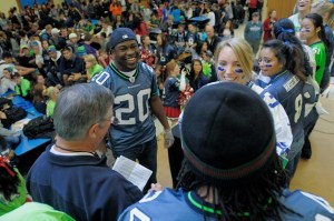 Seahawk running backs Justin Forsett (20) and Marshawn Lynch (24) made an appearance at Juanita High School in Kirkland on Tuesday.