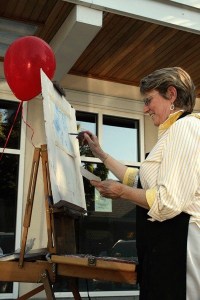 Artist Barbara Noonan creates a picture with soft pastels during Kirkland’s Second Thursday Art Walk in downtown Kirkland August 12.
