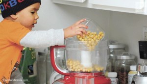 Kirkland resident Sarah De la Cruz's son David helps her cook a vegan dish. De la Cruz is the creator of the blog 'Fried Dandelions