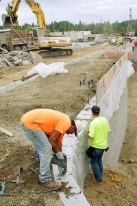 Wilson Concrete laborers Blake Hart and Jaime Santana prepare the sidewalk Sept. 23 for the handrailing.