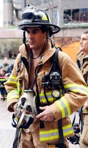 Jon Hernandez of the Kirkland Fire Department prepares for his climb outside the Columbia Tower on Sunday morning.