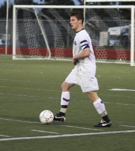Lake Washington captain Taylor Stapf looks for a teammate up field during the Kangs home win over Bellevue on Tuesday night. Lake Washington won 3-0 over the Wolverines.
