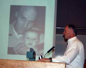 Sen. Rodney Tom (D-Bellevue) testifies in front of a picture of Kollin Neilson and his son to the Kirkland City Transportation Committee Wednesday. Sen. Tom spoke in favor of renaming the N.E. 116th Street bridge over I-405 for Neilson