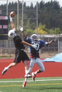 Rebels senior  co-captain and wide receiver Landyn Milburn makes a finger-tip catch during a preseason practice last week.