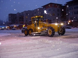 A city worker clears the intersection of N.E. 85th Street and 6th Street in downtown Kirkland Thursday night.