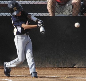Dane Hammer hits a double during the Raptors game in the Triple Crown World Series in Utah last month. The team