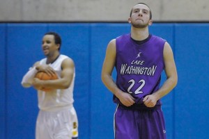 Lake Washington guard Taylor Kramer (22) reacts in the final moments of a double overtime loss to Bellevue in a KingCo semifinal game at Bellevue College on Tuesday.