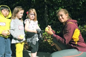 Students from Ben Franklin's kindergarten class have tennis balls signed by Jacqueline Cako of the USA. Cako is part of the main draw of the USTA's Womens Pro Circuit $50