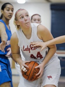 Rebel power forward Kate Cryderman (44) drives to the basket during a game against Kent-Meridian at Juanita on Wednesday.