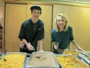 Philip Roe and Stephanie Tilden volunteer to serve food at an Eastside shelter.