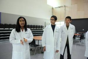 Sophomore Maya Ganesan (left) shares some of the things she enjoys about Lake Washington School District’s new STEM School as Devansh Kukreja and Kevin Nakahara look on.