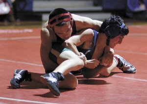 Juanita senior Jonathan Iwasaki wrestles against Liberty during the Rebels win over the Patriots last week.