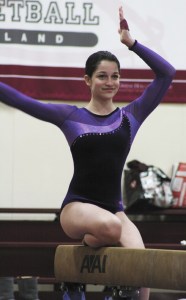 Freshman Amara Cairns competes on the beam last Thursday during Lake Washington's meet against Mercer Island and Sammamish.