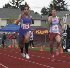Juanita's Alanna Coker sprints to the finish line during the preliminary race of the 100 meter dash. She finished second overall in the finals at the 3A state meet last weekend with a time of 12.28. The winning time was 12.25.