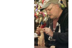 Dennis Brown at work in his  downtown shop last December.