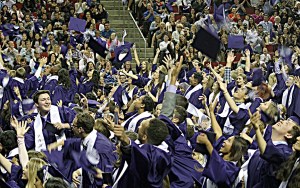 Lake Washington High School graduates celebrate with a toss of their hats. Kathryn Reith/LWSD