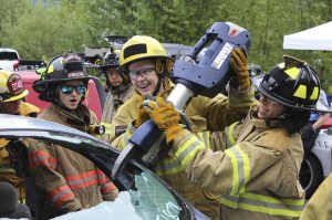 Women from around the Eastside train with the jaws of life during a firefighting camp in Bellevue. Allison DeAngelis/Bellevue Reporter