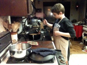 Kristopher DiGiulio prepares chili in his kitchen in Kirkland. His alligator chili recipe is featured in a new cookbook.