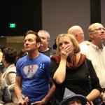 People anxiously watch the national election results come in at the Washington State Democrats election night party on Nov. 8, 2016 (Allison DeAngelis/staff photo).