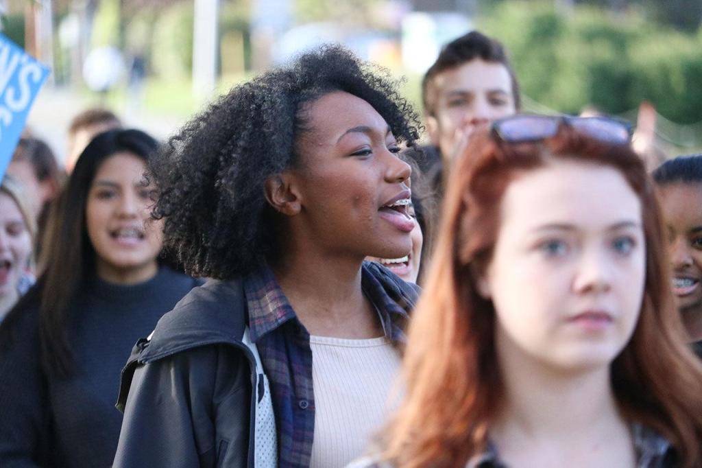 Juanita High junior Tamani Smart cheers during a student protest on Nov. 14. JOHN WILLIAM HOWARD/Kirkland Reporter