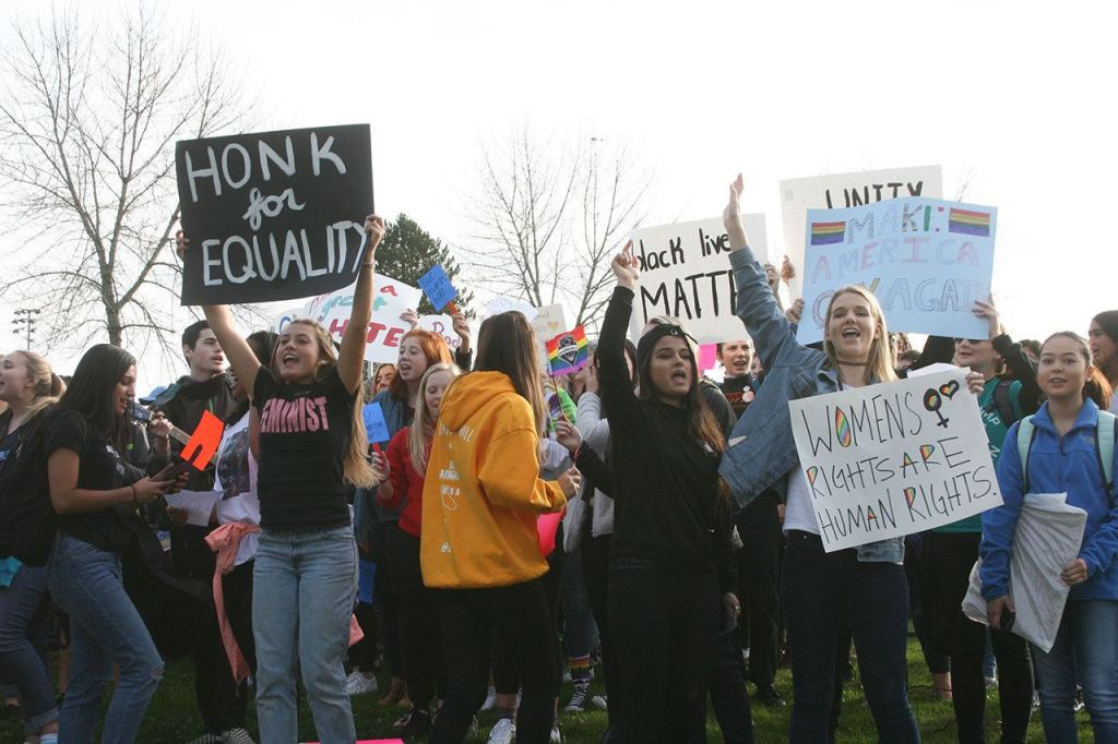 Lake Washington High students call out to passing cars during a protest on Nov. 14. CATHERINE KRUMMEY/Kirkland Reporter