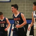 Juanita&rsquo;s Ryan Troutman (12) celebrates after hitting a big shot in the second half of the Rebels&rsquo; season opener on Nov. 28. Trautmann is one of several players the Juanita coaches hope will step into scoring roles around the experience returning players. JOHN WILLIAM Howard/Kirkland Reporter