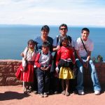 Kirkland resident Matilde Melendez (back row, left) poses for a photo with her husband, Armando Melendez; her son, Armando Melendez; and some local children. near Lake Titicaca in Peru. She has started her own business, Conquer Peru, in which she coordinates travel plans to the country for customers. Submitted photo