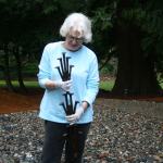 Merrily Dicks holds a sample of &ldquo;The Spikes&rdquo; sculpture that is displayed in her Kirkland backyard. One of her assistants, Yancy McCoy, helped create this piece. The full sculpture has been installed on the Cross Kirkland Corridor. CATHERINE KRUMMEY/Kirkland Reporter