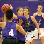 Lake Washington senior Tori Bivens looks to pass past fellow senior Kathy Helf during preseason practice. Bivens, though she played basketball last year, is one of several players better known for their successes in other sports. JOHN WILLIAM HOWARD/Kirkland Reporter