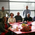 Kirkland City Hall front desk volunteers and staff, along with Volunteer Coordinator Patrick Tefft (standing, second from left), gather for an end-of-year appreciation breakfast. CATHERINE KRUMMEY/Kirkland Reporter