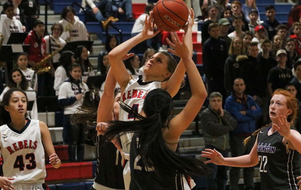 Juanita junior Hannah Kleppe attacks the rim during the Rebels&rsquo; 64-44 win over Lake Washington on Dec. 16. JOHN WILLIAM HOWARD/Kirkland Reporter