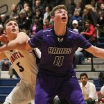 Lake Washington sophomore Griffin Barker fends off Juanta senior Ravi Regan-Hughes during the first half of the Kangs&rsquo; 58-51 win on Friday evening. Barker finished with 17 points and 21 rebounds. JOHN WILLIAM HOWARD/Kirkland Reporter