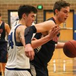 Juanita&rsquo;s Ravi Regan-Hughes (5) tangles with Bothell senior JR Plourd during the second half of Juanita&rsquo;s loss on Dec. 29 at Bothell High School. Regan-Hughes led the Rebels with 17 points, mostly in the second half. JOHN WILLIAM HOWARD/Kirkland Reporter