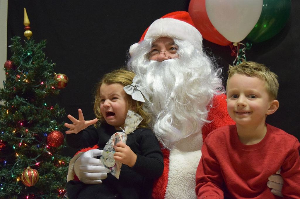 Aubrey, left, and Mason Eggers sit with Santa during the Columbia Athletic Club&rsquo;s 35th anniversary party. Julianna Jade/Contributed photo