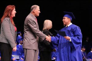 Anthony Ramos-Estrada of Kirkland graduates from the Washington Youth Academy on Dec. 17 and is congratulated by Secretary of State Kim Wyman and Gov. Jay Inslee. Contributed photo