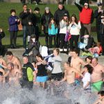 Polar Bear Plunge participants enter Lake Washington at Marina Park in Kirkland. CATHERINE KRUMMEY/Kirkland Reporter