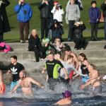 Polar Bear Plunge participants enter Lake Washington at Marina Park in Kirkland. CATHERINE KRUMMEY/Kirkland Reporter