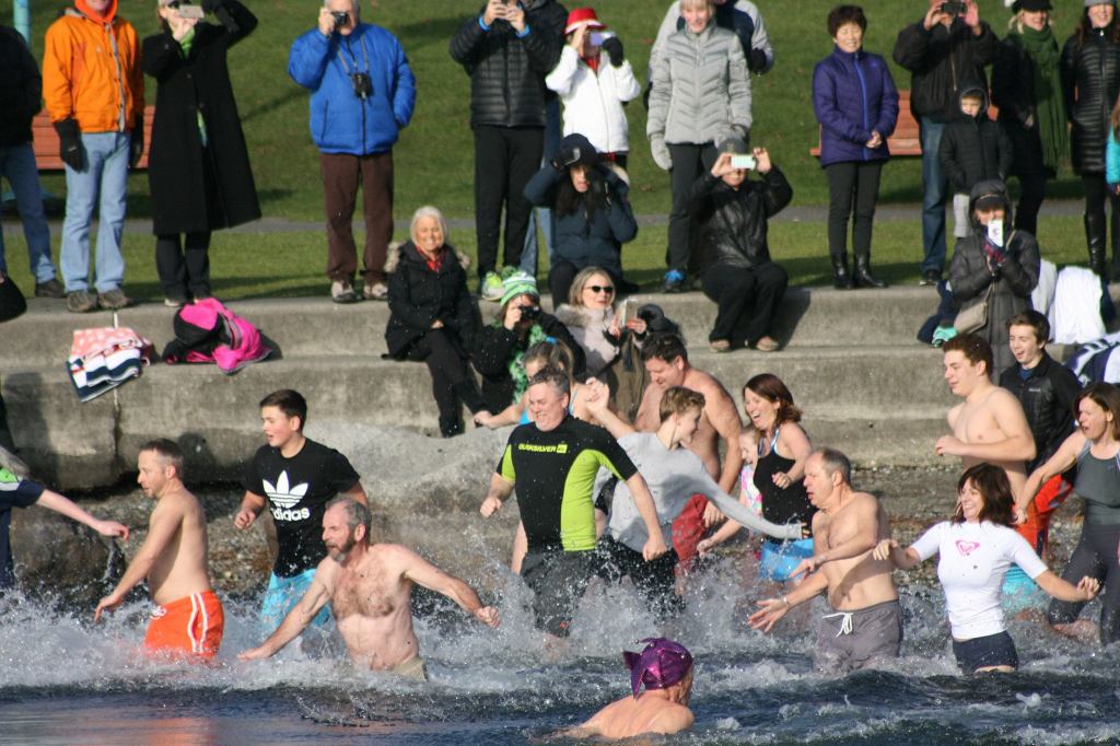 Polar Bear Plunge participants enter Lake Washington at Marina Park in Kirkland. CATHERINE KRUMMEY/Kirkland Reporter