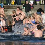 Polar Bear Plunge participants enter Lake Washington at Marina Park in Kirkland. CATHERINE KRUMMEY/Kirkland Reporter