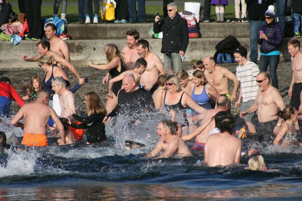 Polar Bear Plunge participants enter Lake Washington at Marina Park in Kirkland. CATHERINE KRUMMEY/Kirkland Reporter