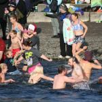 Polar Bear Plunge participants enter Lake Washington at Marina Park in Kirkland. CATHERINE KRUMMEY/Kirkland Reporter