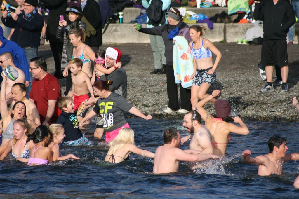 Polar Bear Plunge participants enter Lake Washington at Marina Park in Kirkland. CATHERINE KRUMMEY/Kirkland Reporter