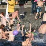 Polar Bear Plunge participants enter Lake Washington at Marina Park in Kirkland. CATHERINE KRUMMEY/Kirkland Reporter